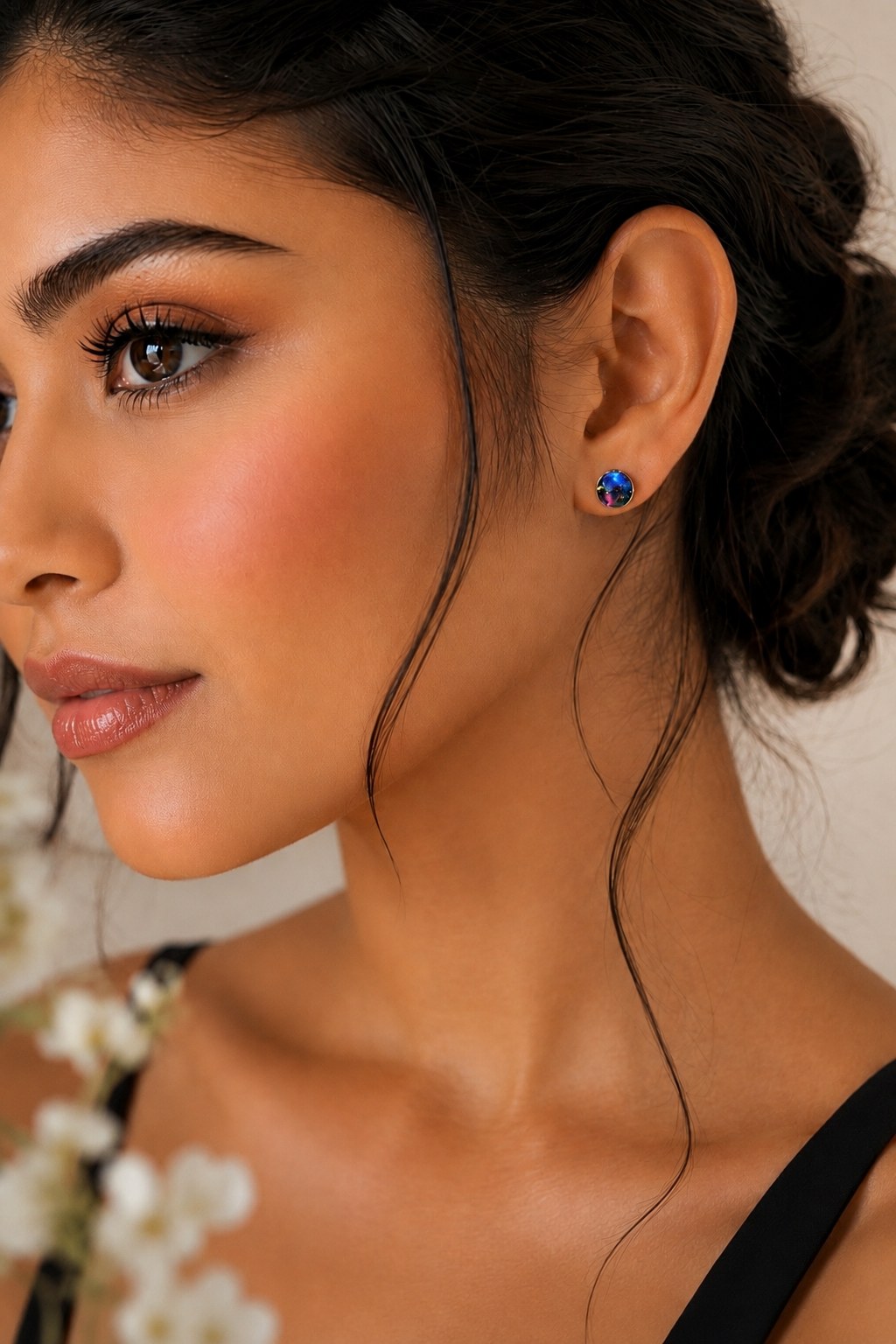 Blue and purple memorial stud earrings worn on a model