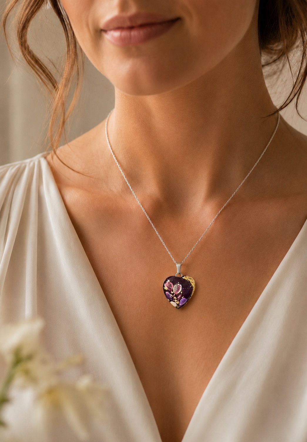 Purple floral heart memorial pendant worn on a model