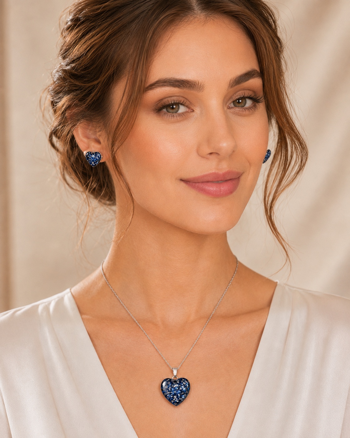 Blue and silver heart memorial jewellery set worn on a model