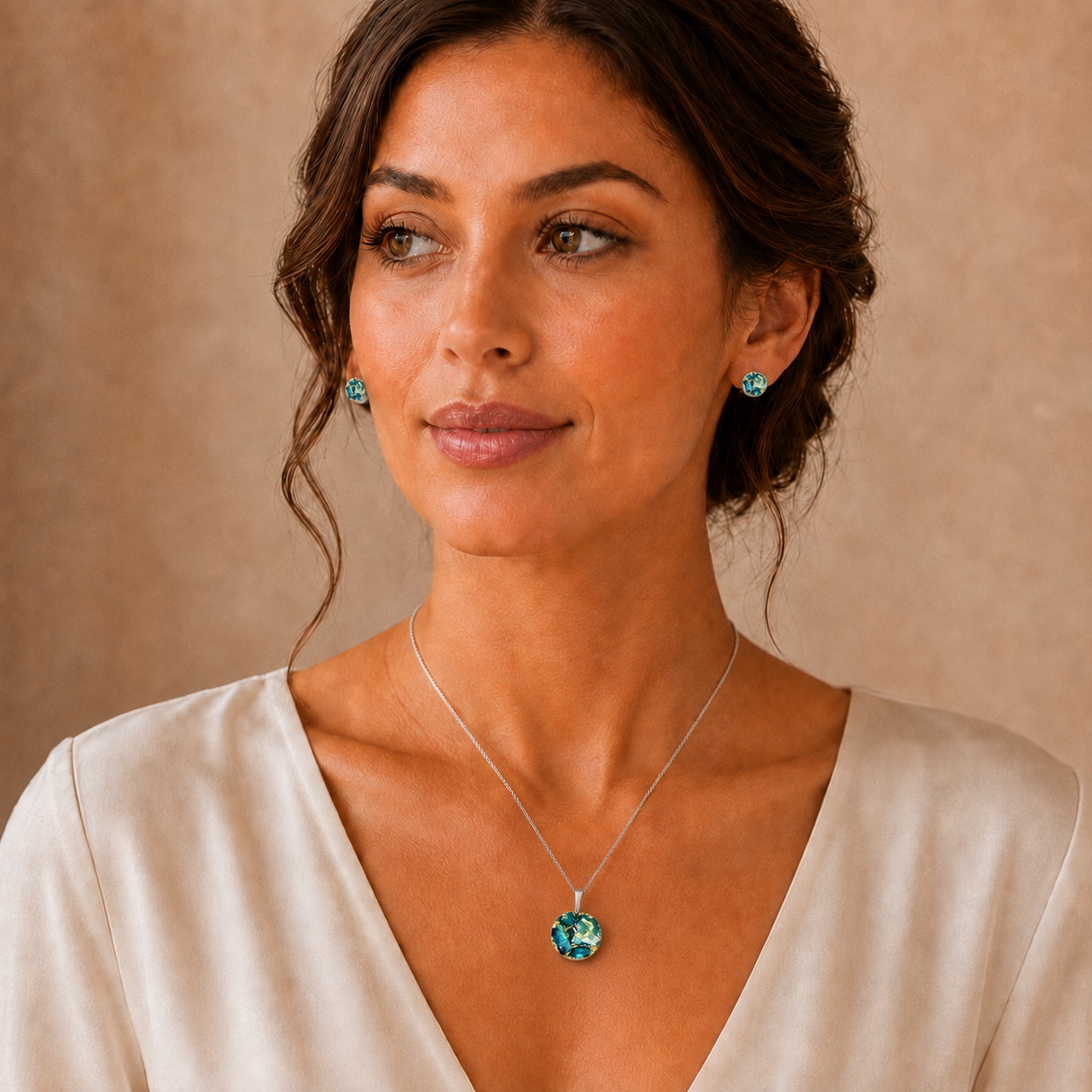 Turquoise, pearl and gold round memorial jewellery set worn on a model