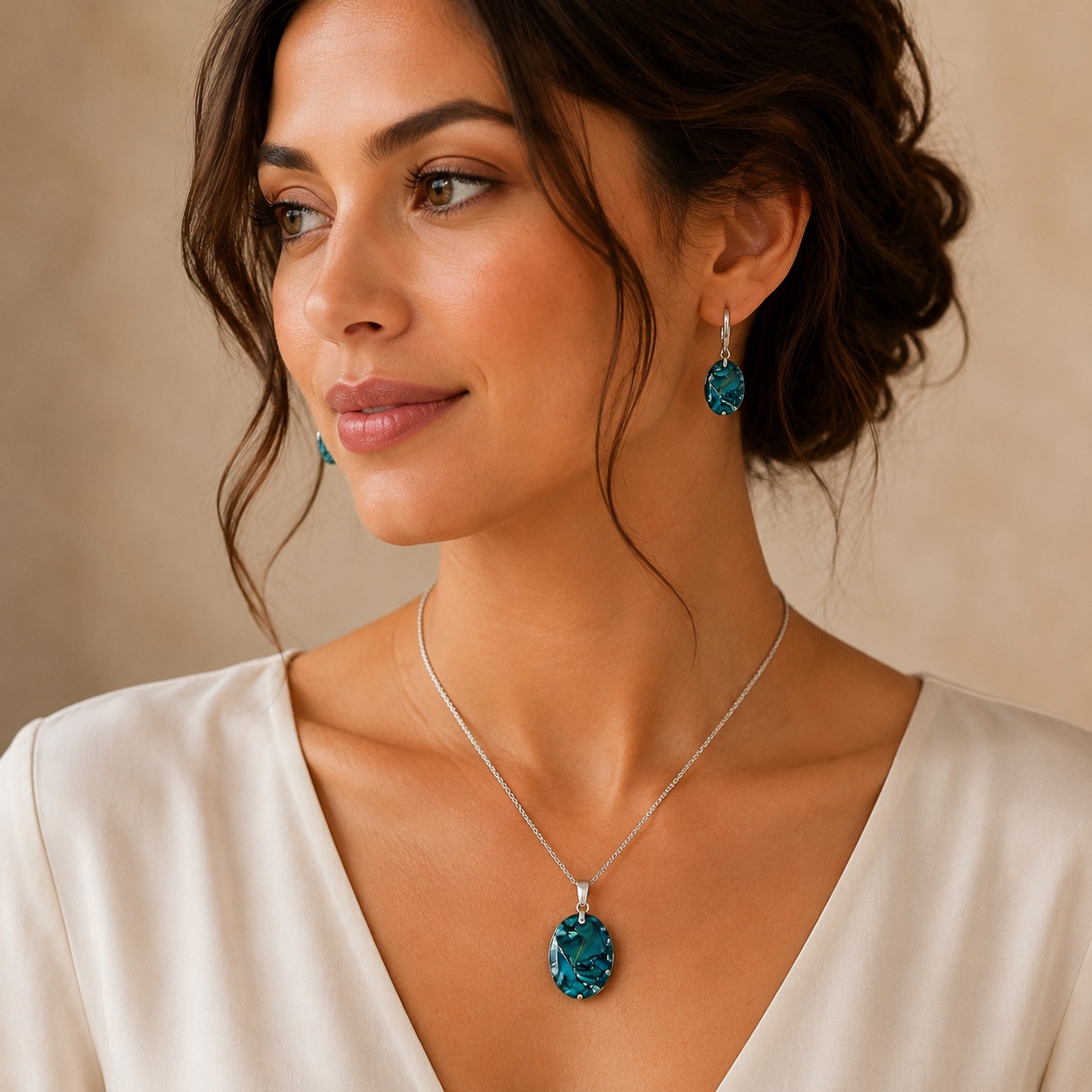 Turquoise oval pendant and drop earring memorial jewellery set worn on a model