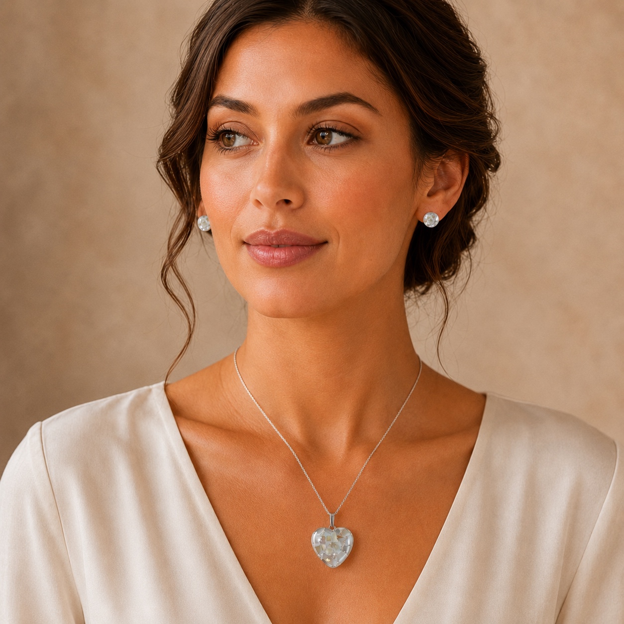 White mosaic heart and stud memorial jewellery set worn on a model